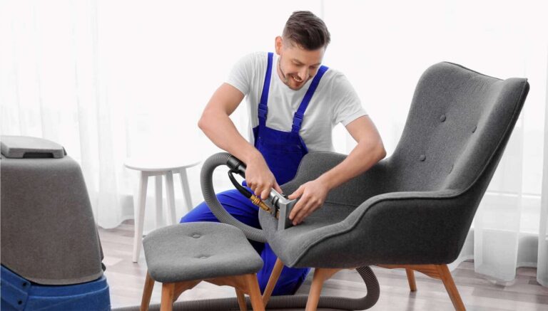 Service Technician Cleaning an Upholstered Chair